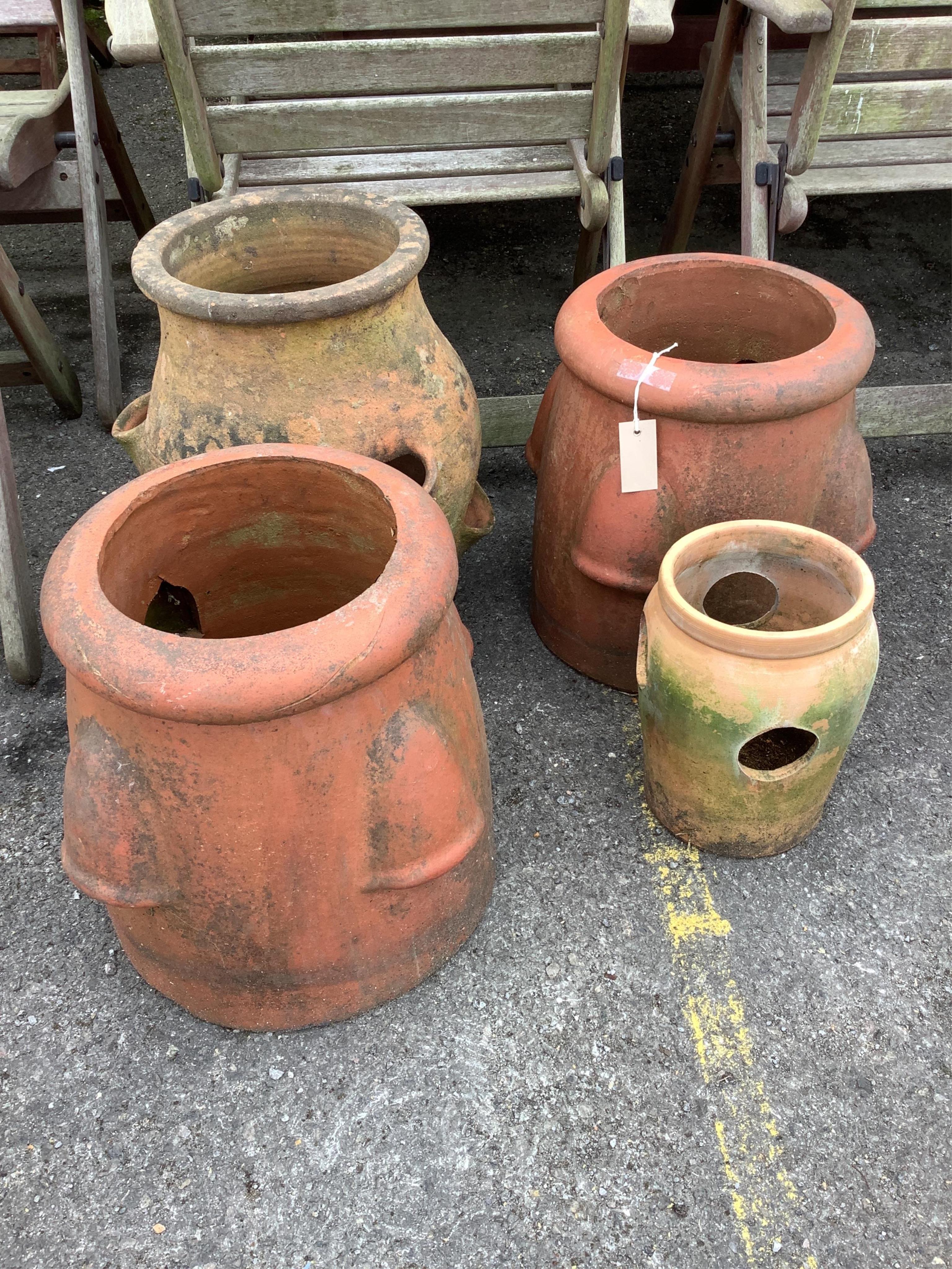 Four terracotta strawberry pots, largest diameter 30cm, height 48cm